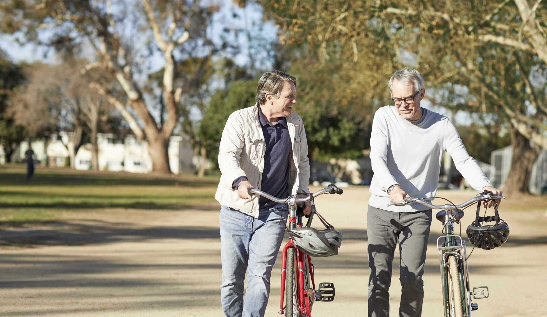 Two men riding bikes