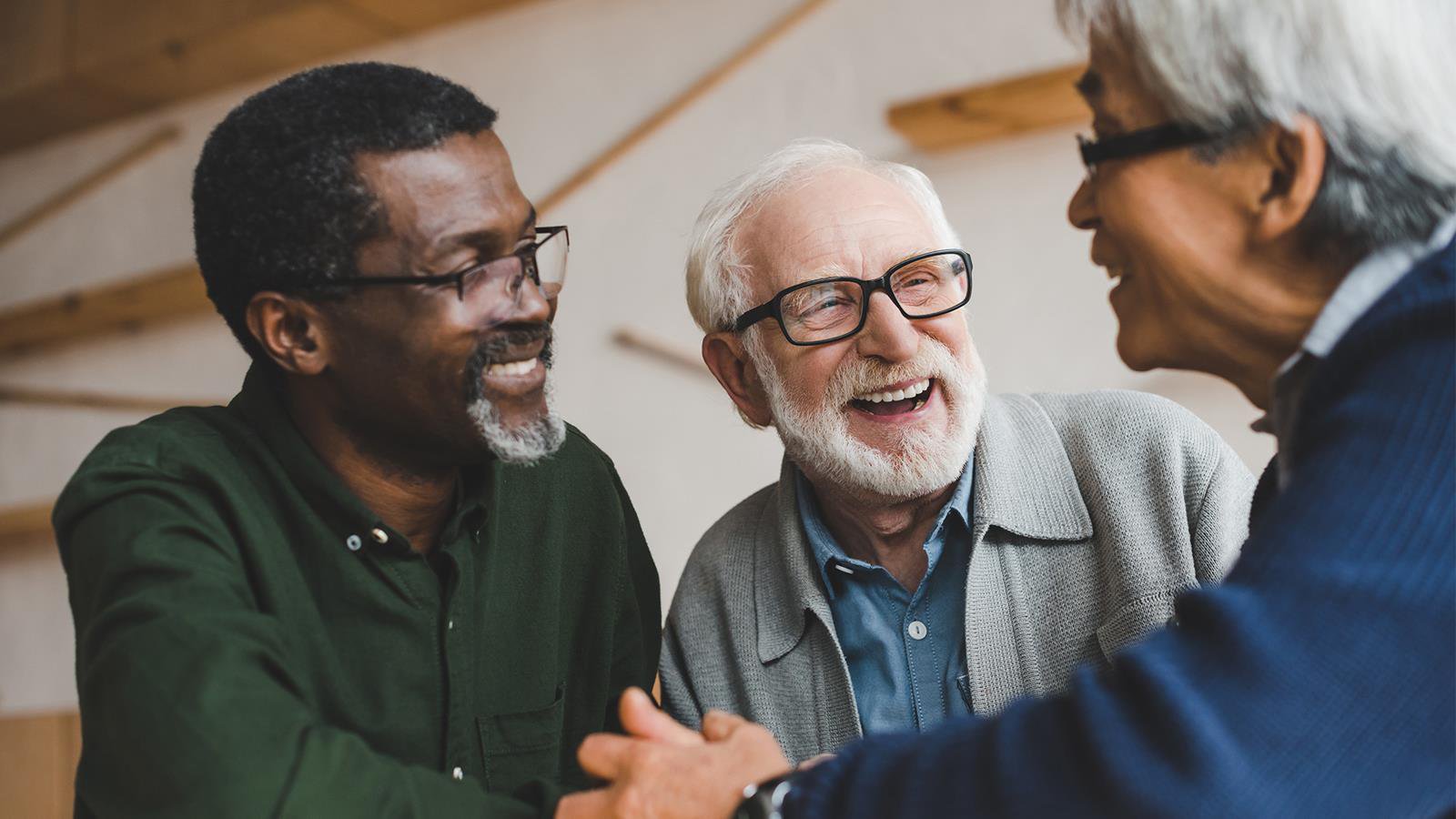 Men talking and smiling