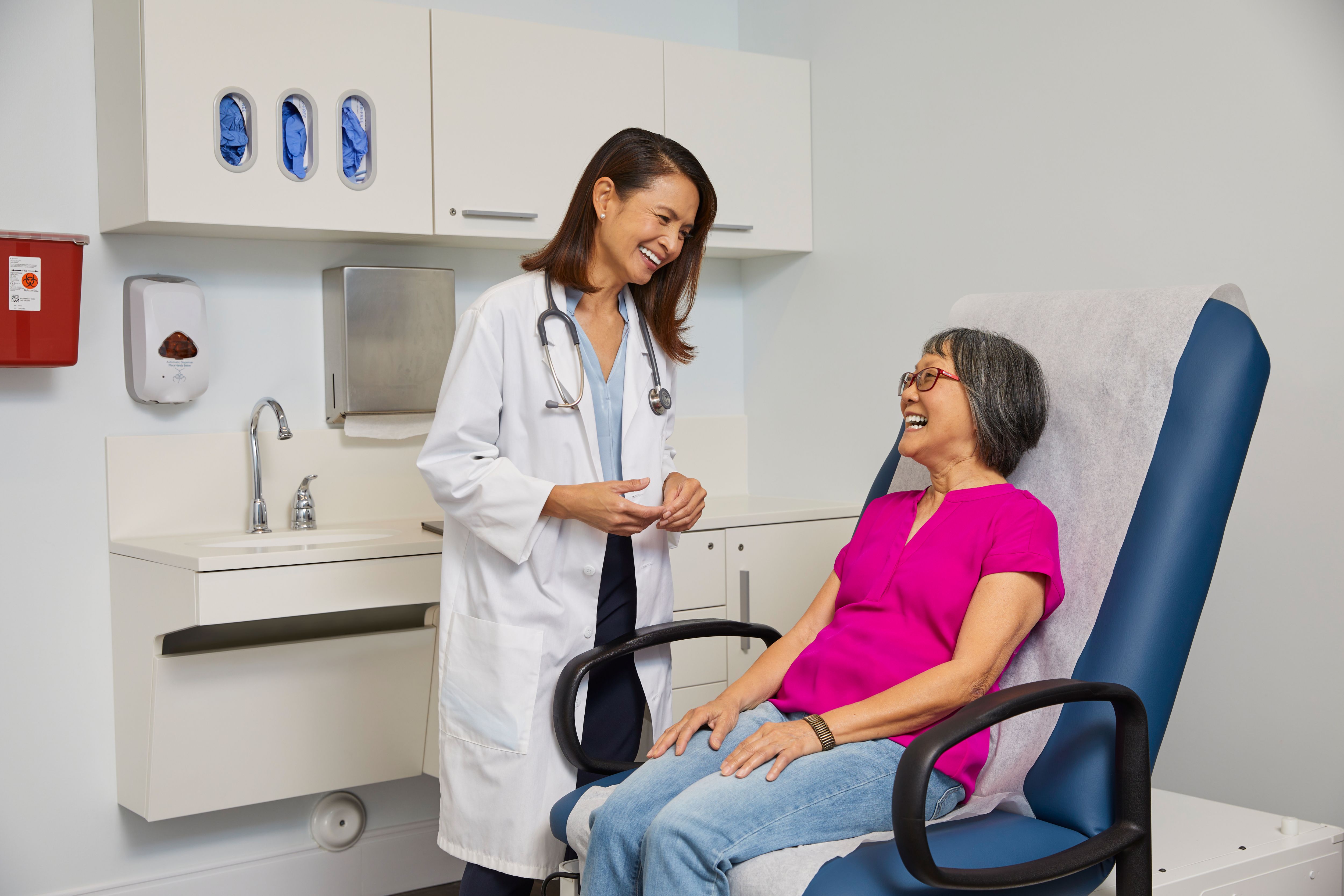 Female doctor is meeting with female patient during exam