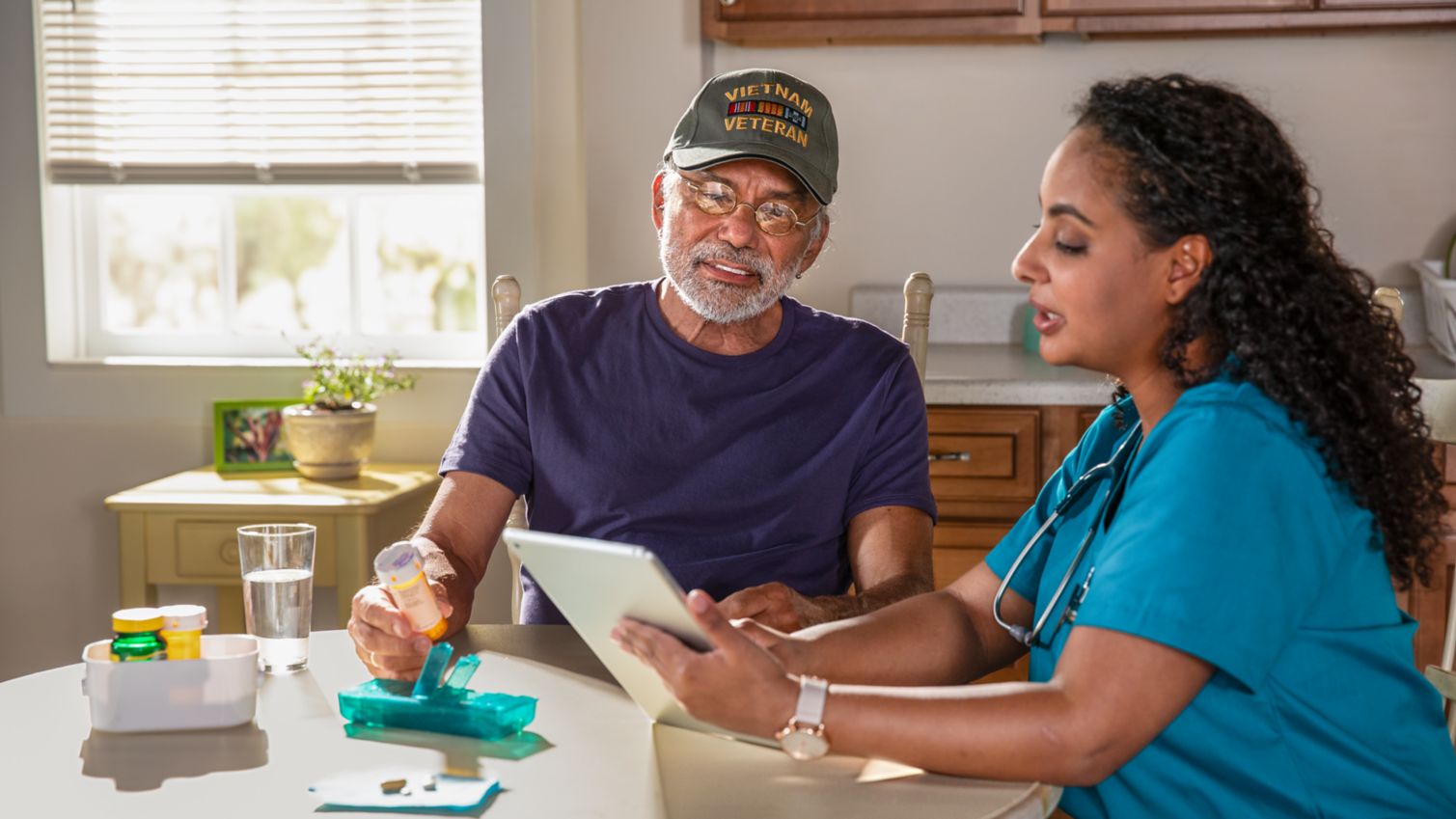 A caregiver goes over a patient's medicine information