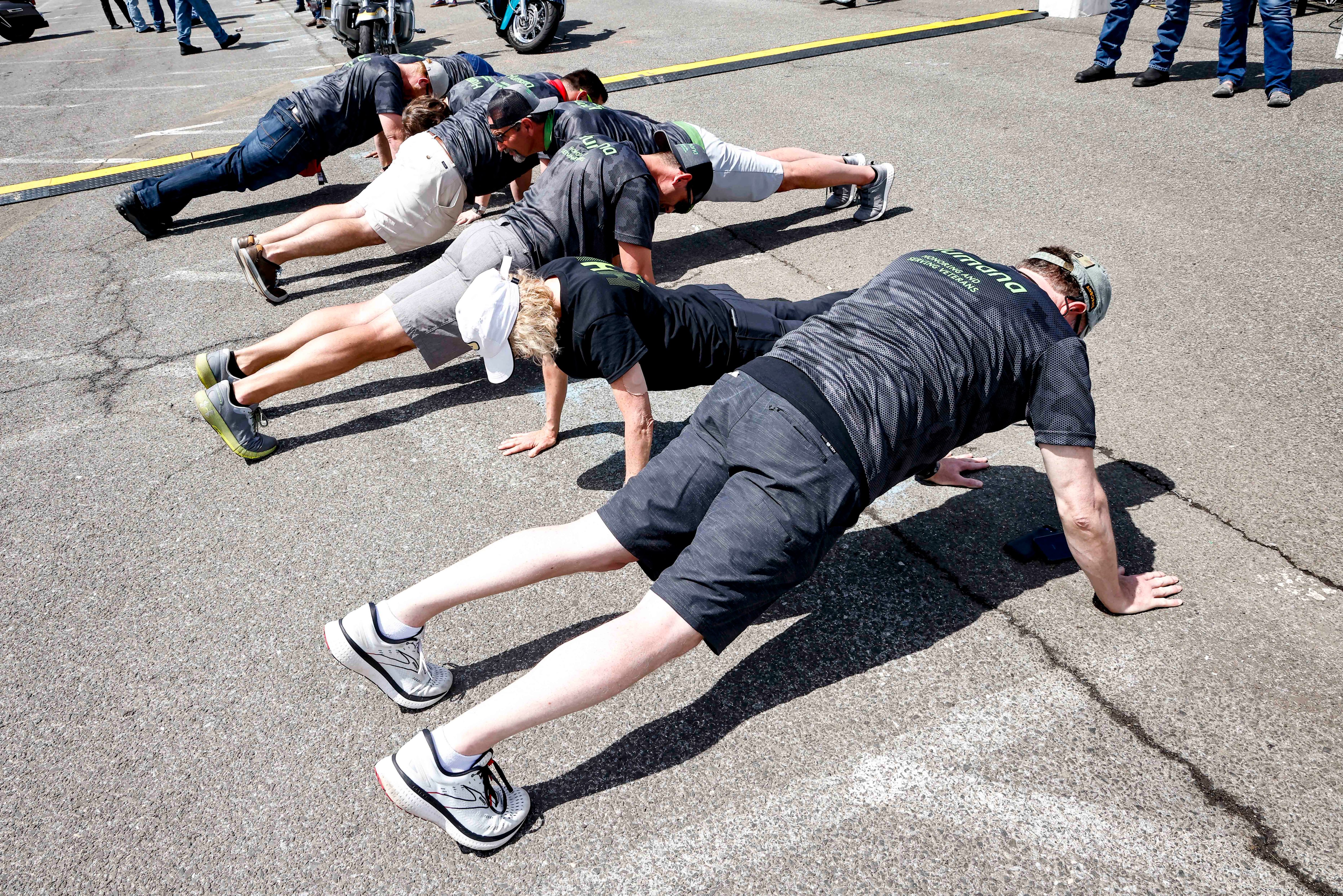 Humana associates participate in the Guinness World Record attempt   gathering the largest number of people doing push-ups together   for Veteran suicide awareness at RFK Stadium on Saturday, May 28, 2022 in Washington D.C. The group met at 2:22 p.m. for 22 push-ups, representing the 22 Veterans who die daily from suicide. (Paul Morigi/AP Images for Humana, Inc.)