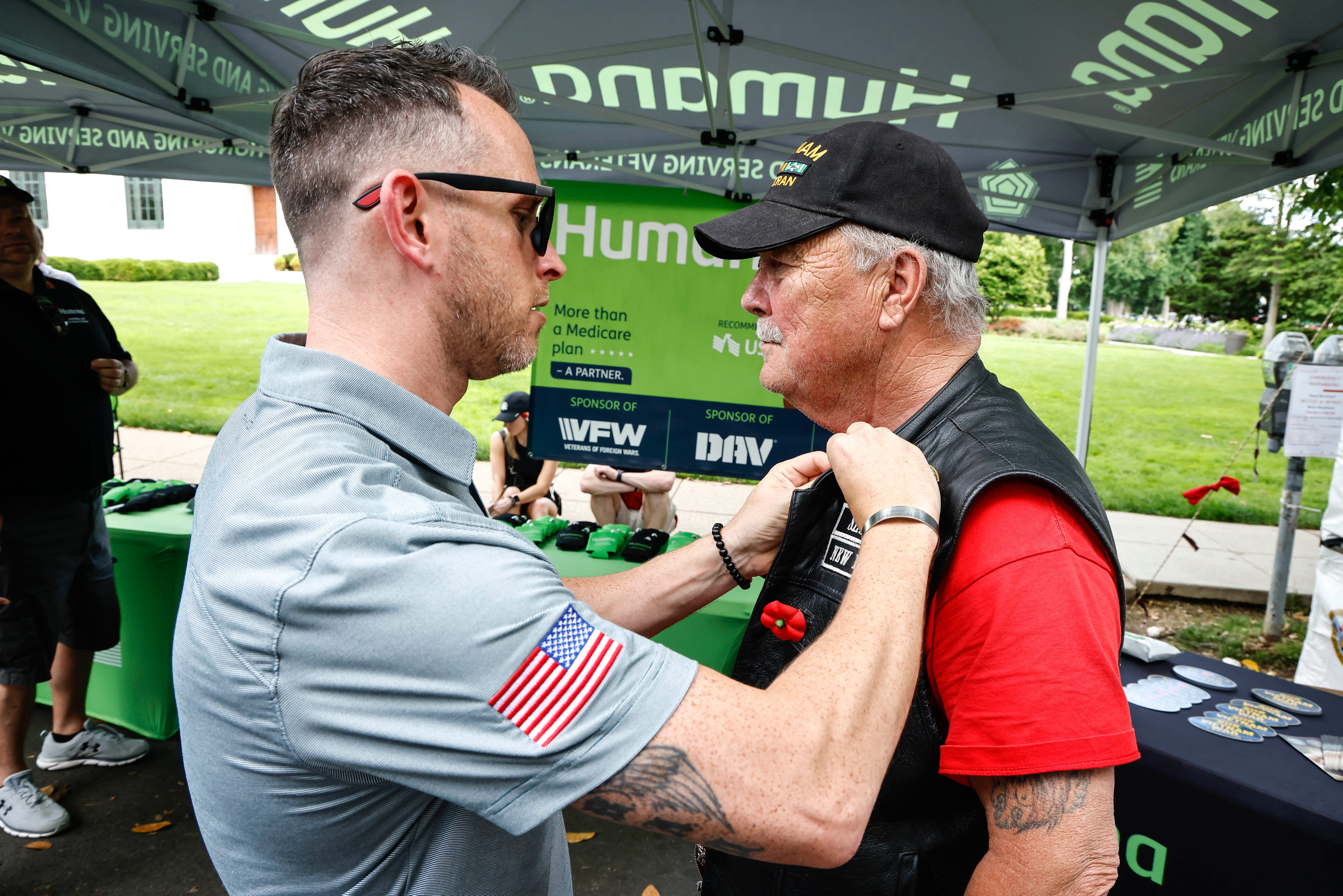 Humana associates assist Veterans at the company booth in Thunder Alley on Saturday, May 28, 2022 in Washington D.C. (Paul Morigi/AP Images for Humana, Inc.)