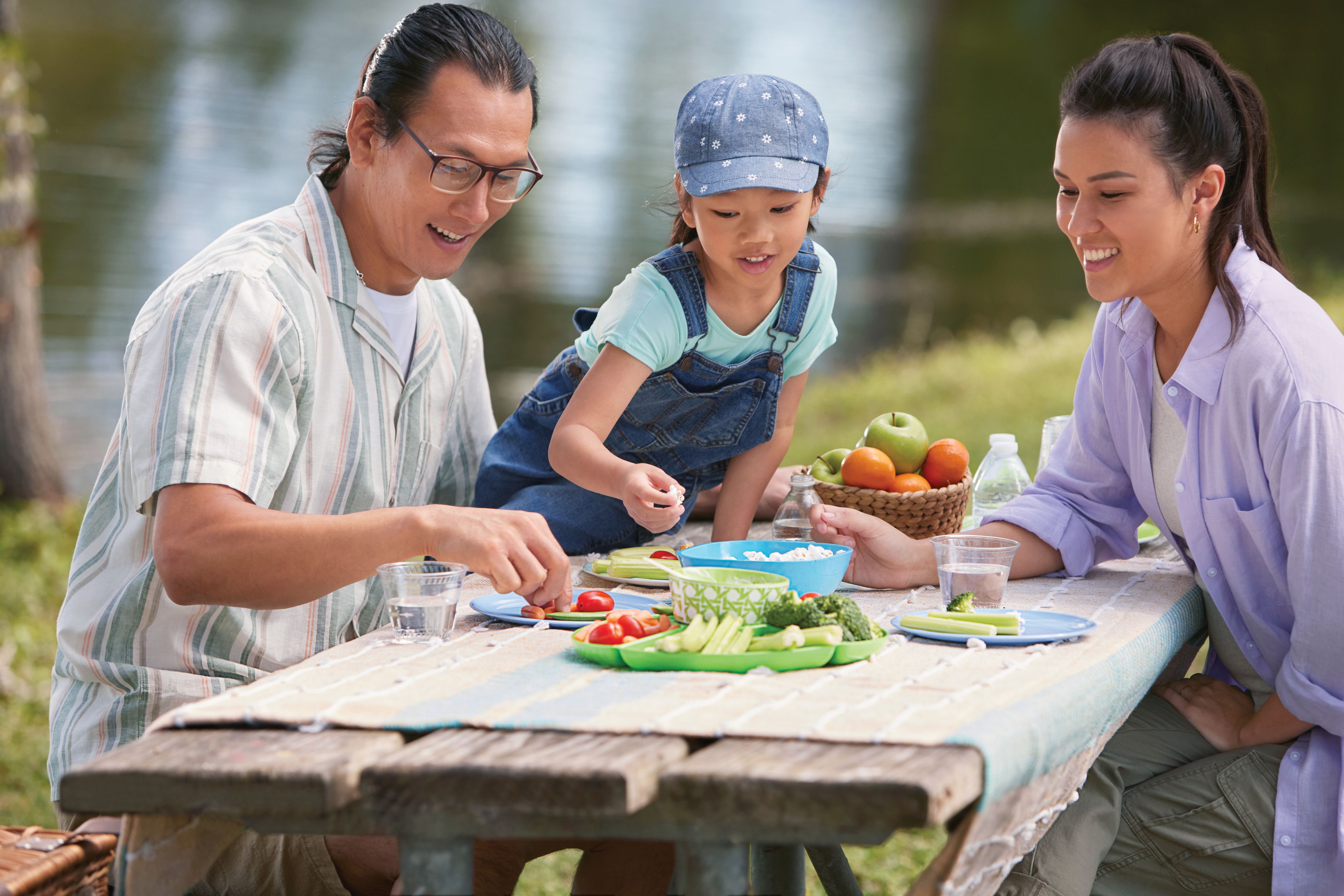 Couple with young child fishing