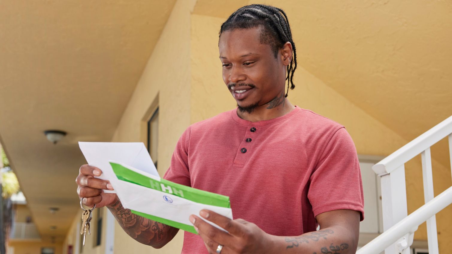 Adult getting mail from mailbox