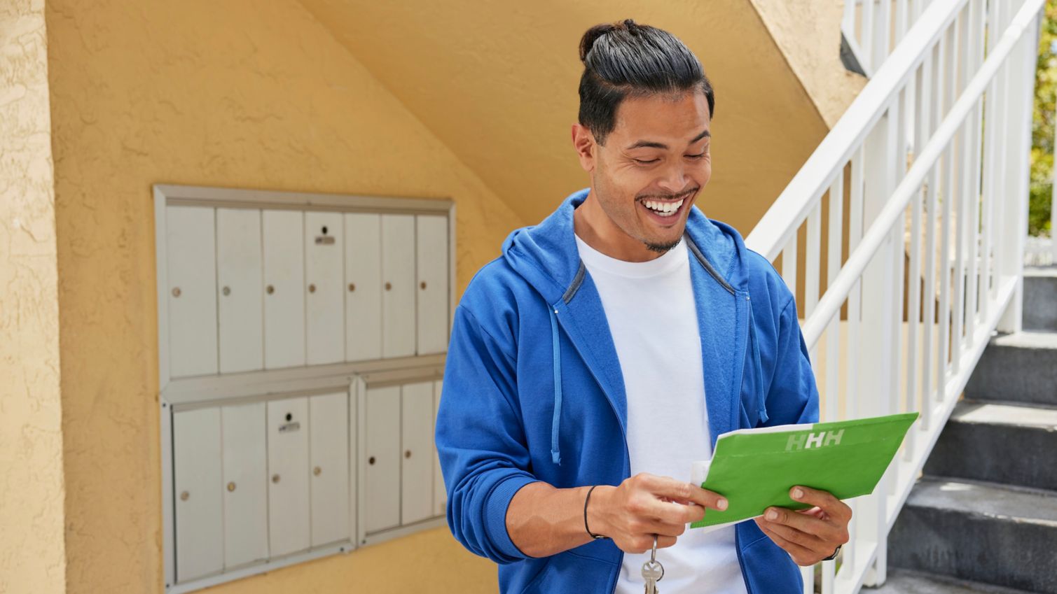 Adult getting mail from mailbox
