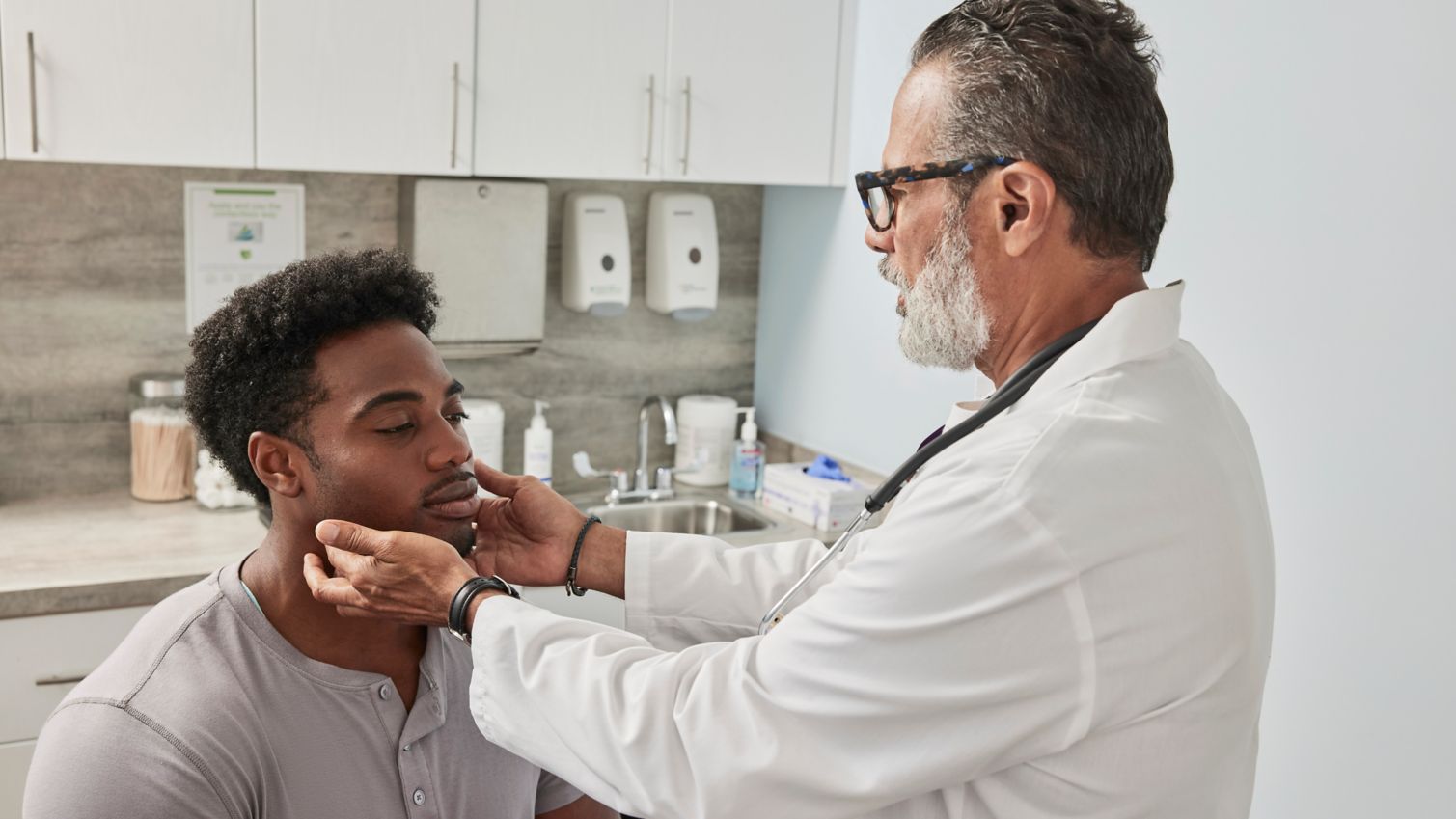 A provider checking on a patient.