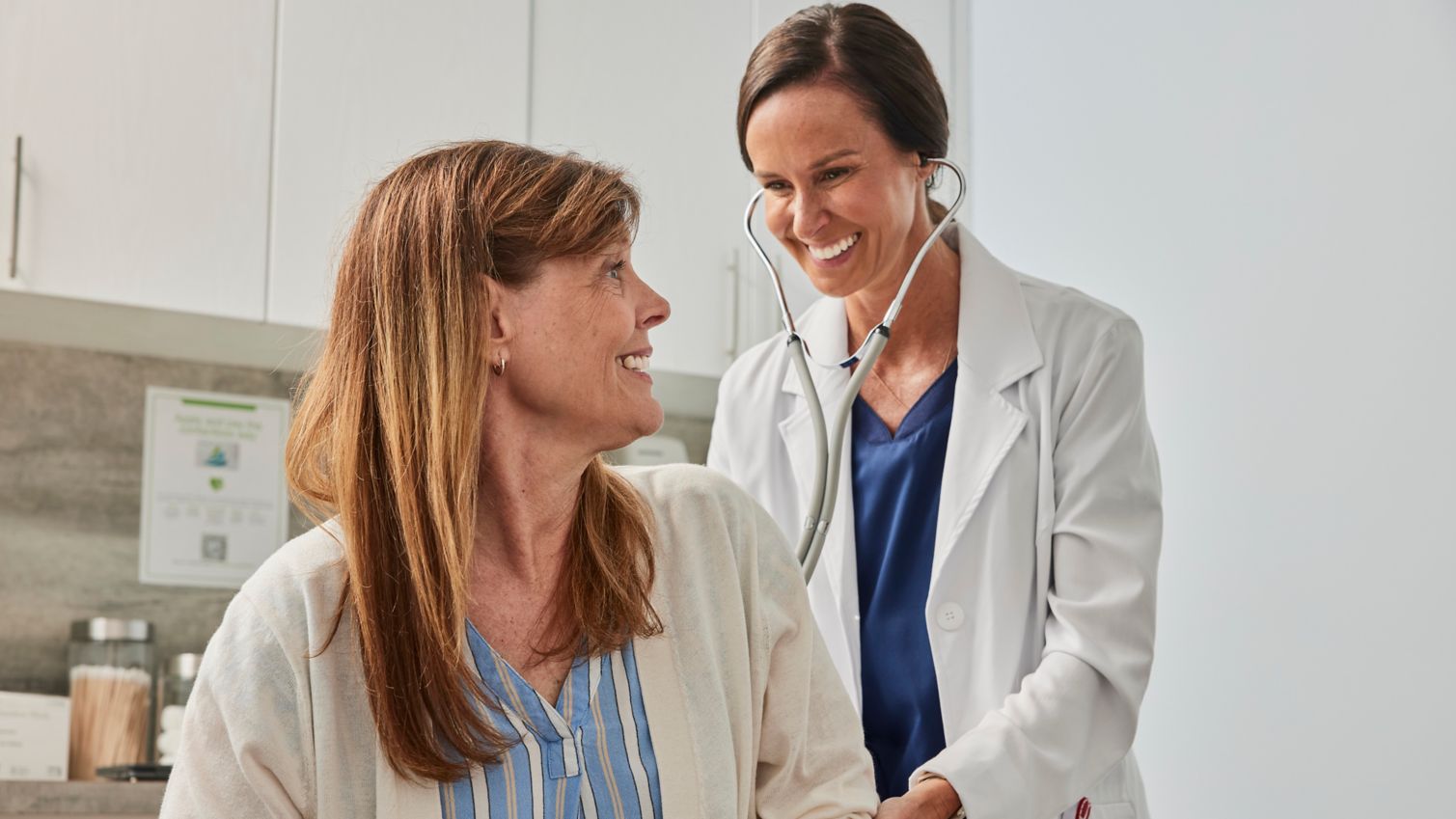 A patient in an exam room with a healthcare provider