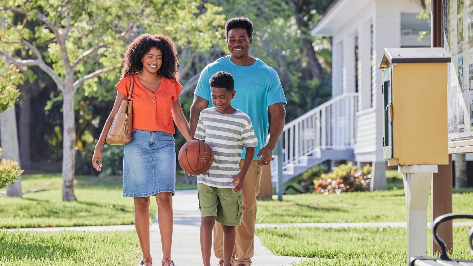 Family walking on a sidewalk