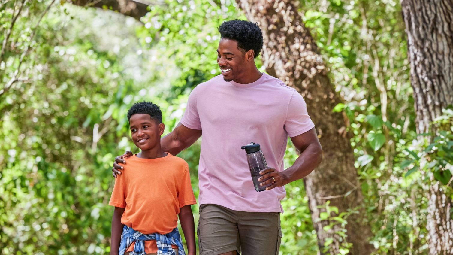 Dad and son walking outside