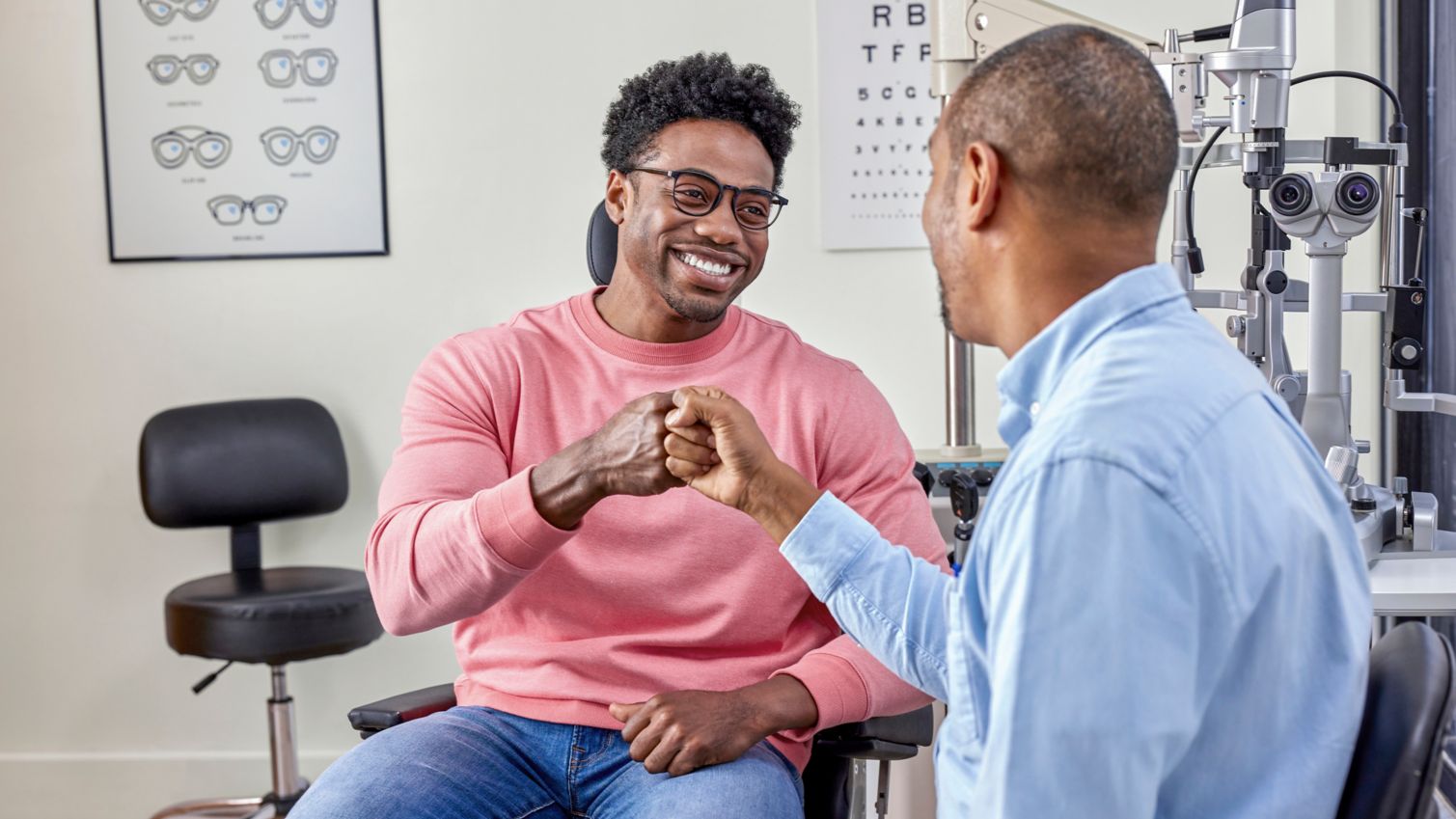 Adult talking with optometrist for exam