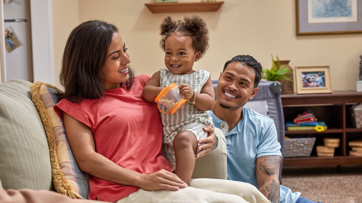 Parents and infant playing