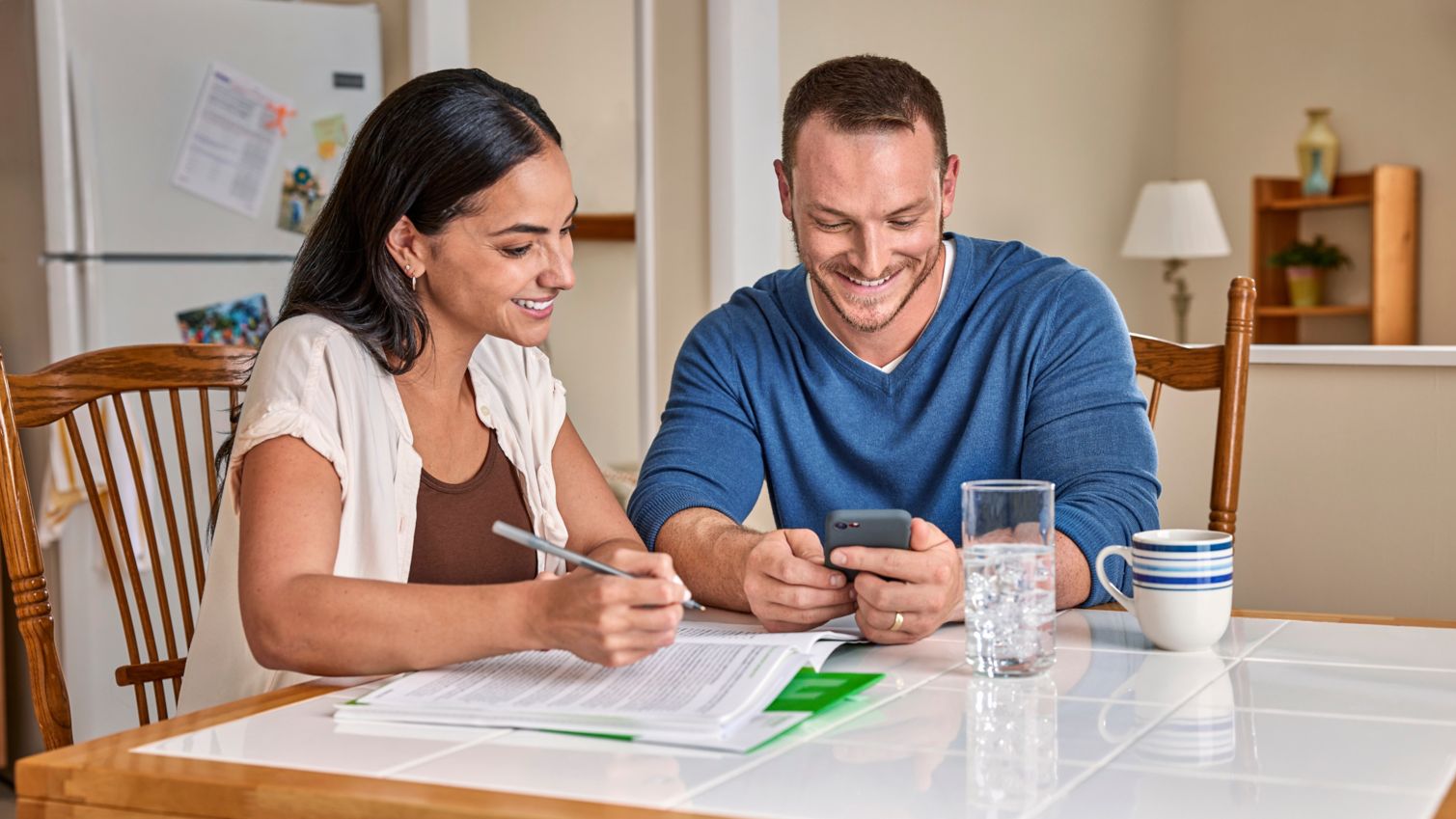 Man and woman sitting in the kitchen together