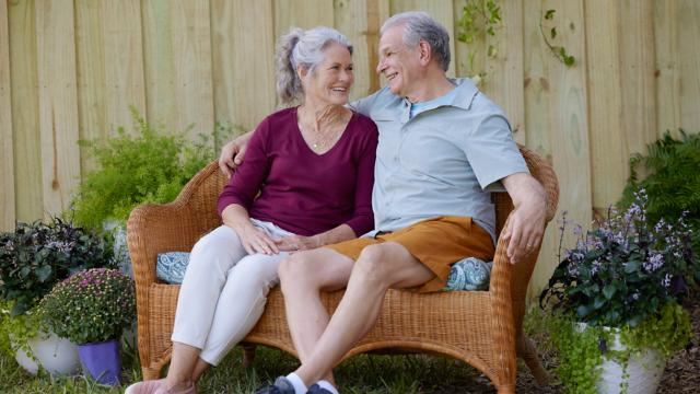 Couple sitting outside on bench