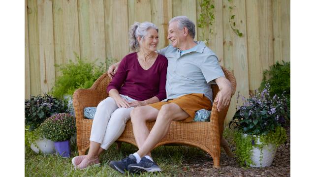 Couple sitting outside on bench