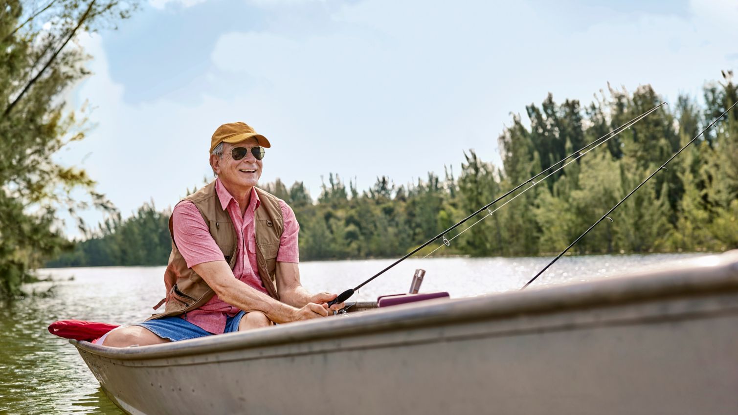Senior fishing in a boat on a river