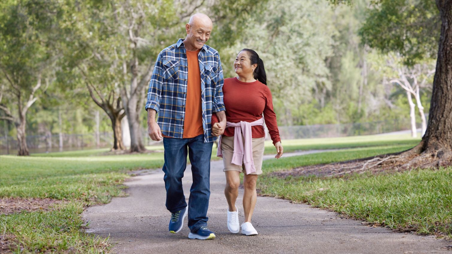 Seniors walking in park