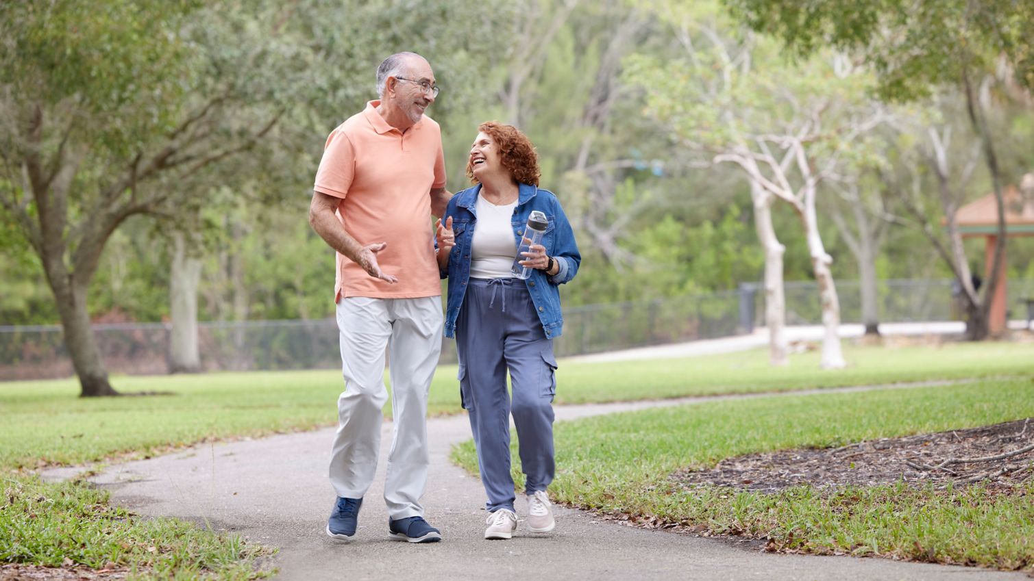 Seniors walking in park being active exercising