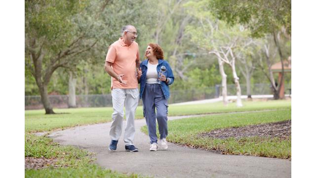 Seniors walking in park being active exercising