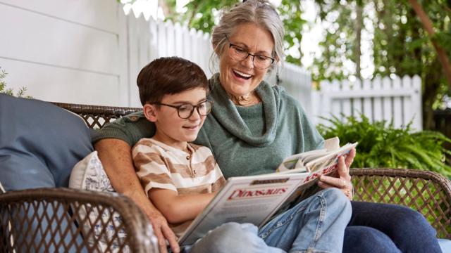 senior reading to child