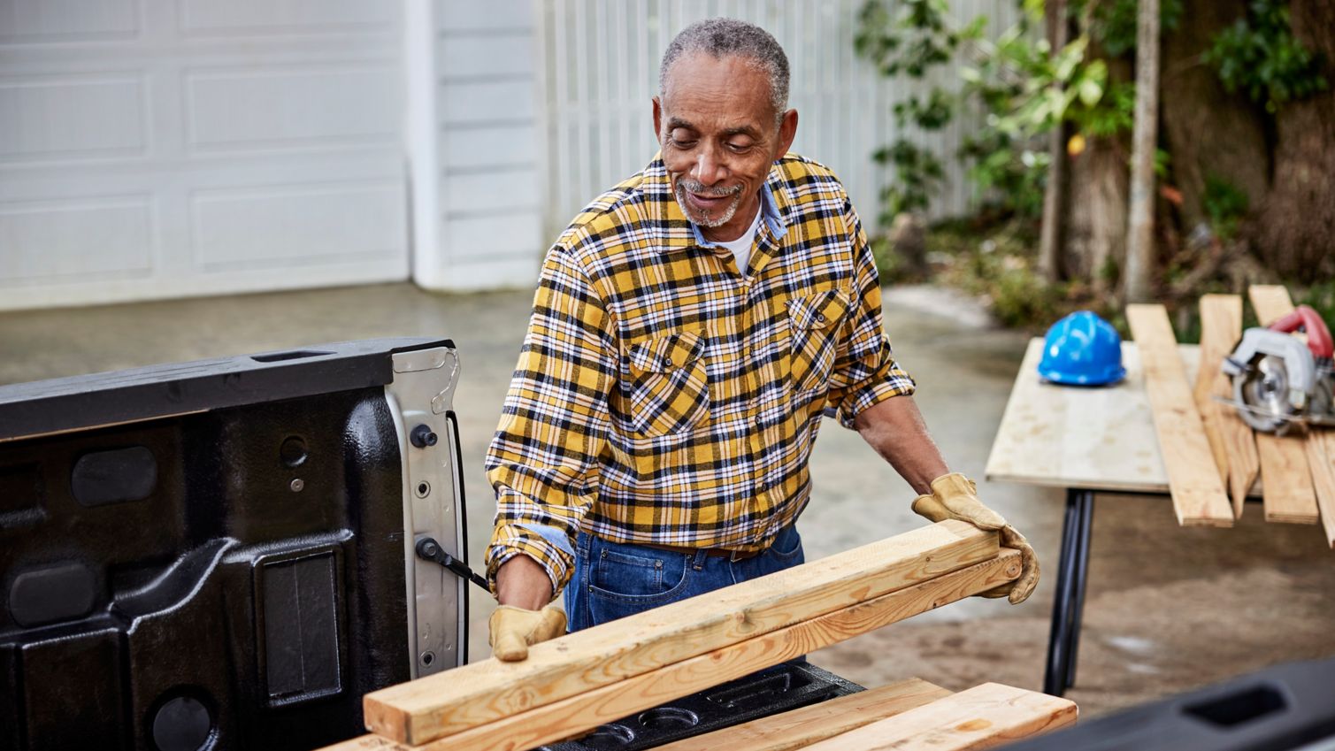 Senior pulling wood from truck