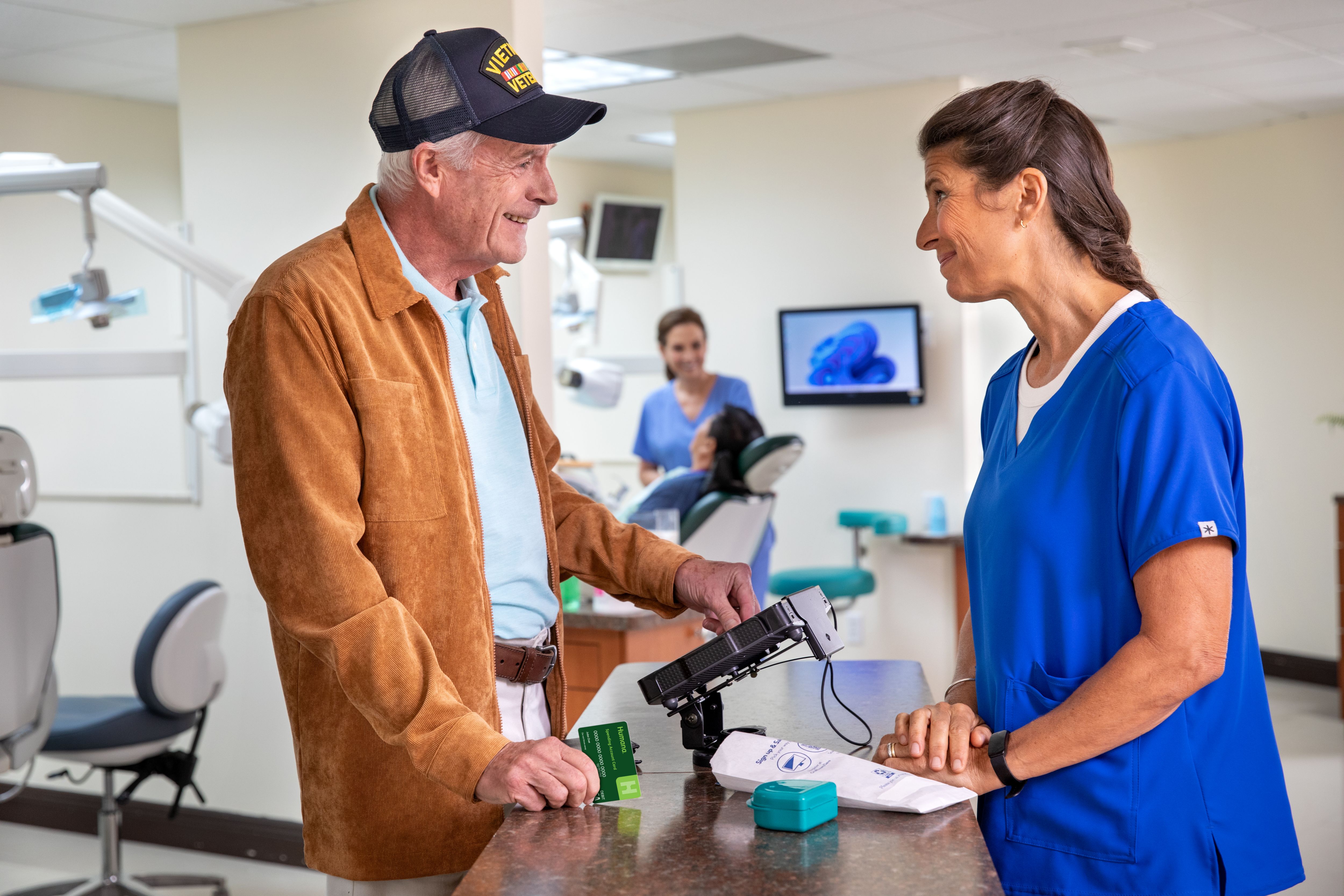 Veteran talking with pharmacist