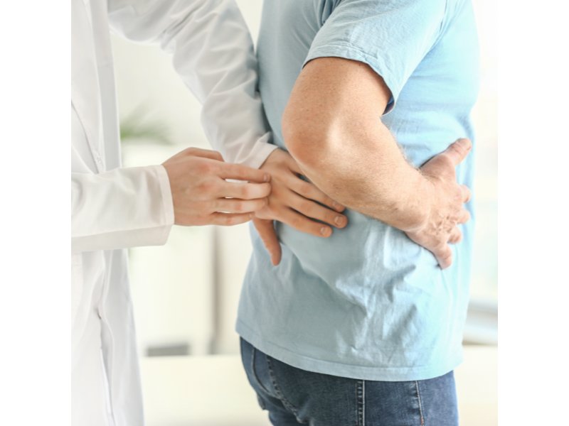 Doctor performing kidney test
