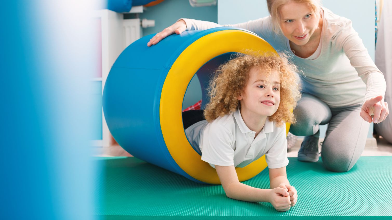 A young child works with their therapist. 