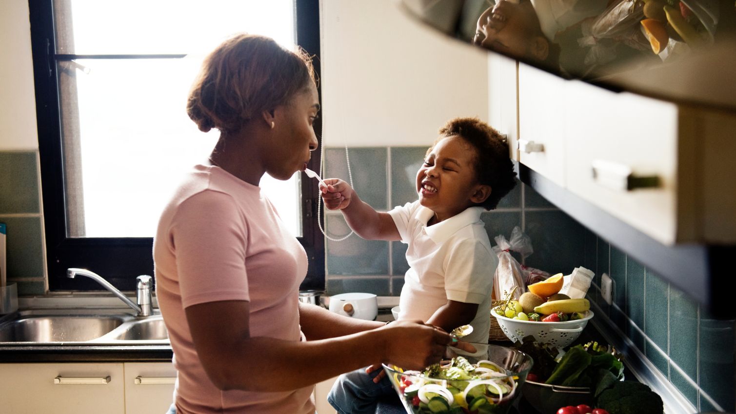 A mother and a child in the kitchen