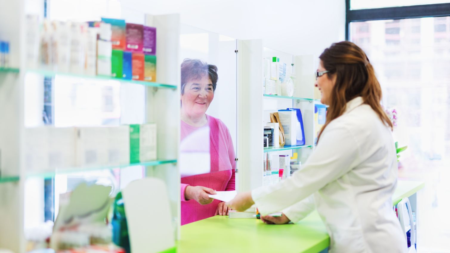 member talking to pharmacist