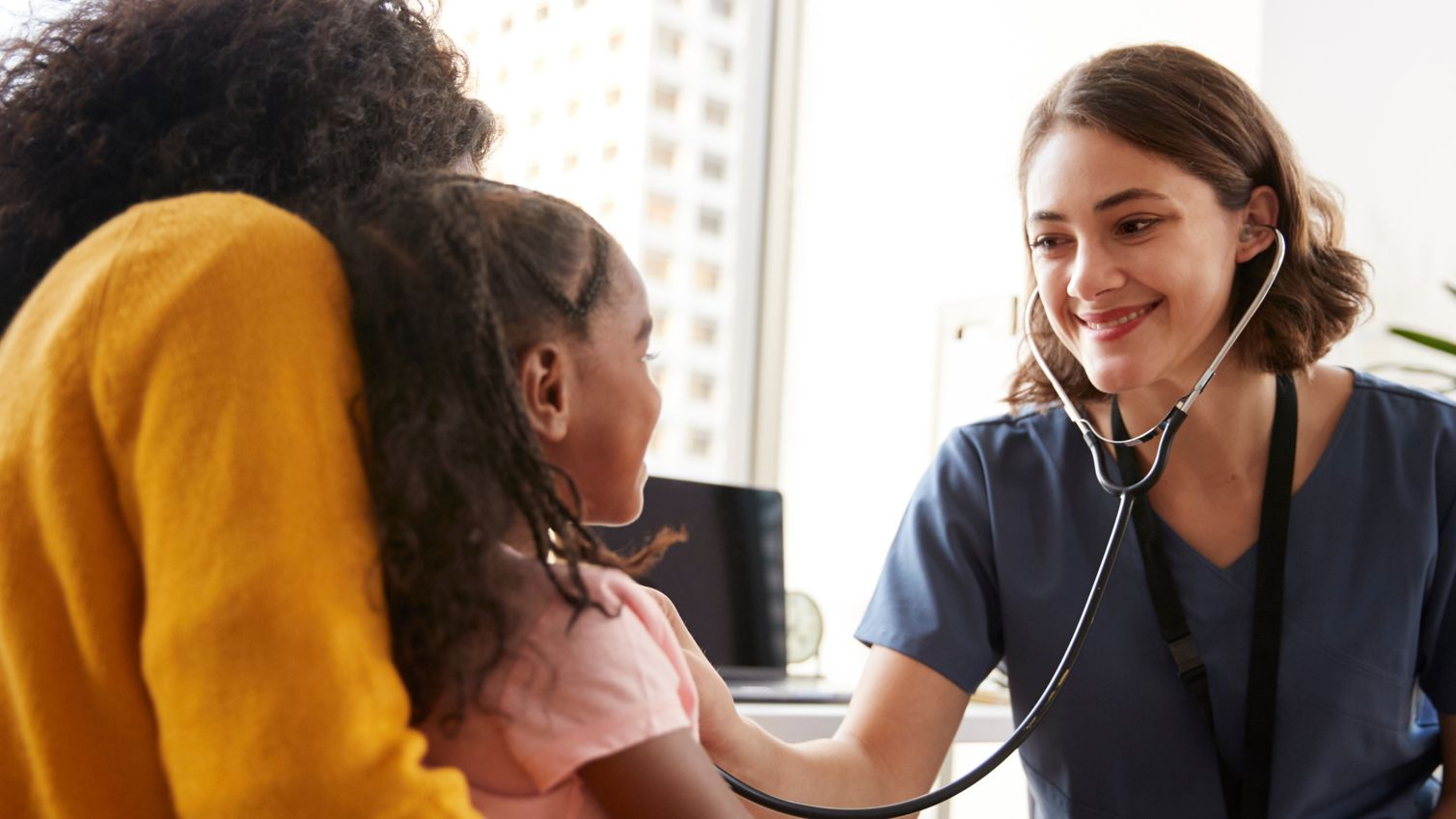 medical professional checking heartbeat