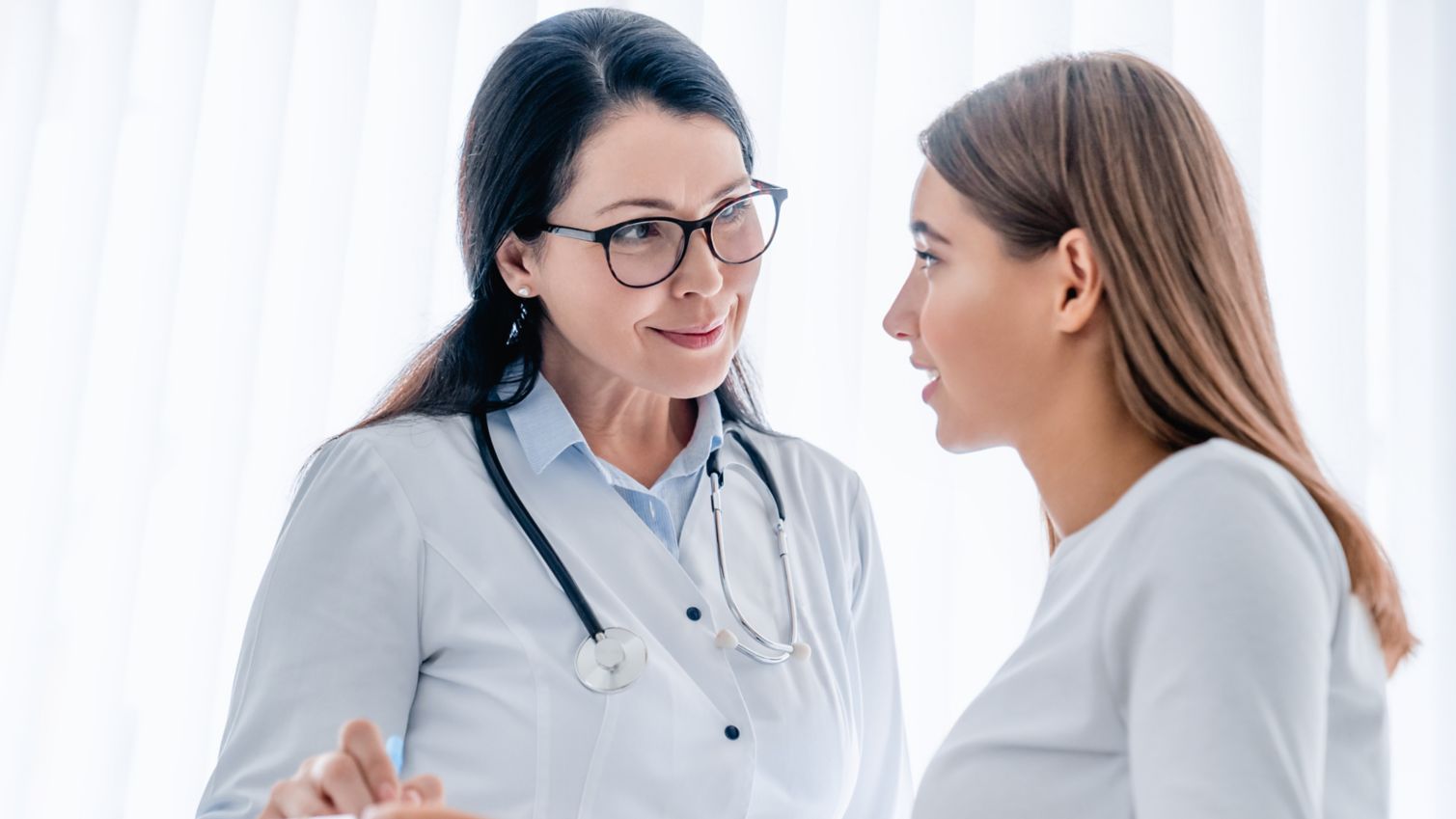 A young patient speaking with a doctor