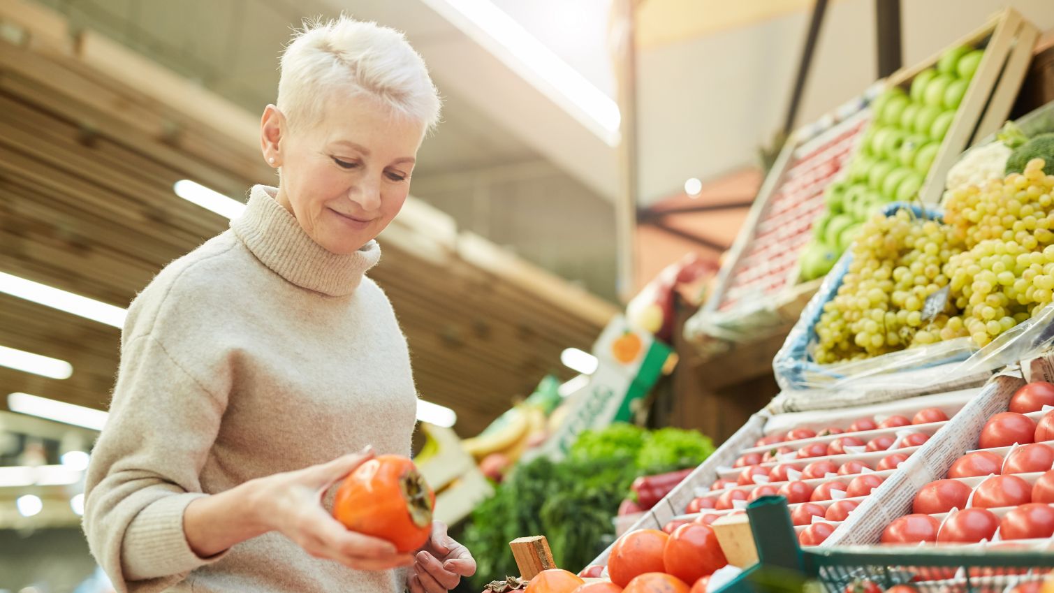 A woman shops for produce at the local grocery