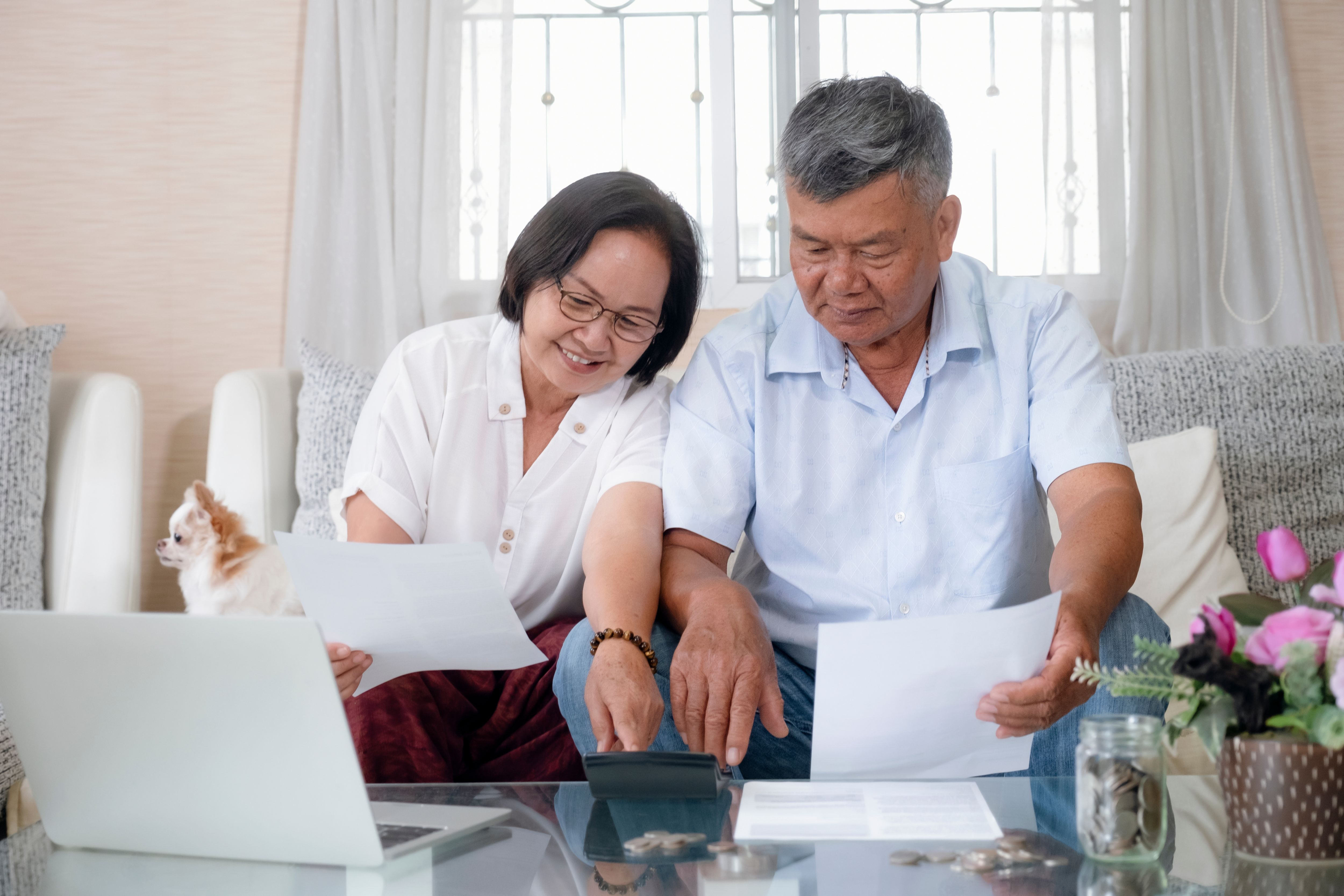 Asian senior couple doing and calculating home finances.  Retriement planning.