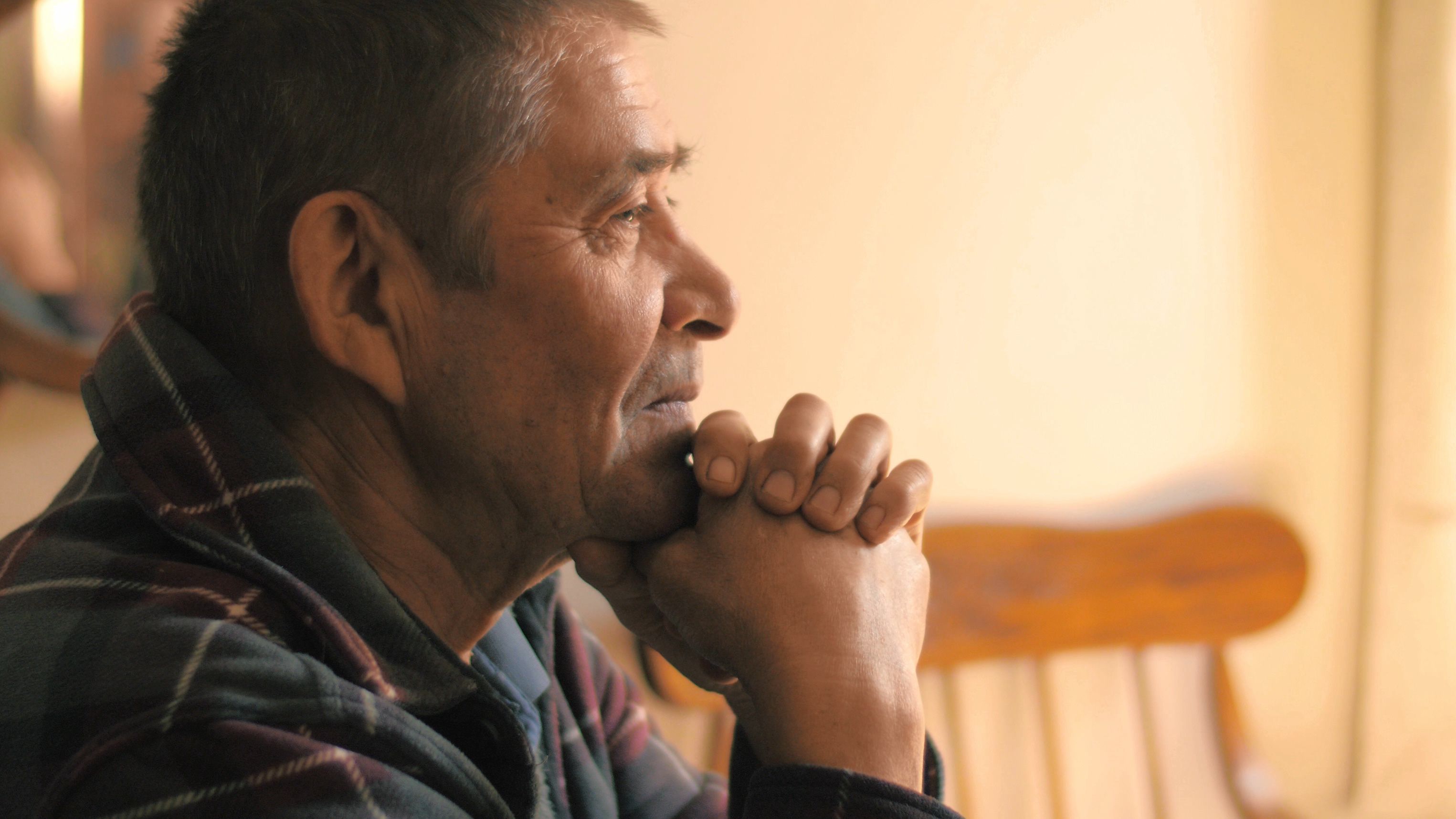 Happy calm relaxed senior man at dinner table at home, looking ahead, thinking. Portrait, Close up, 4k UHD