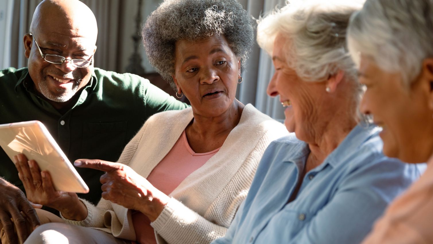 people looking at a tablet