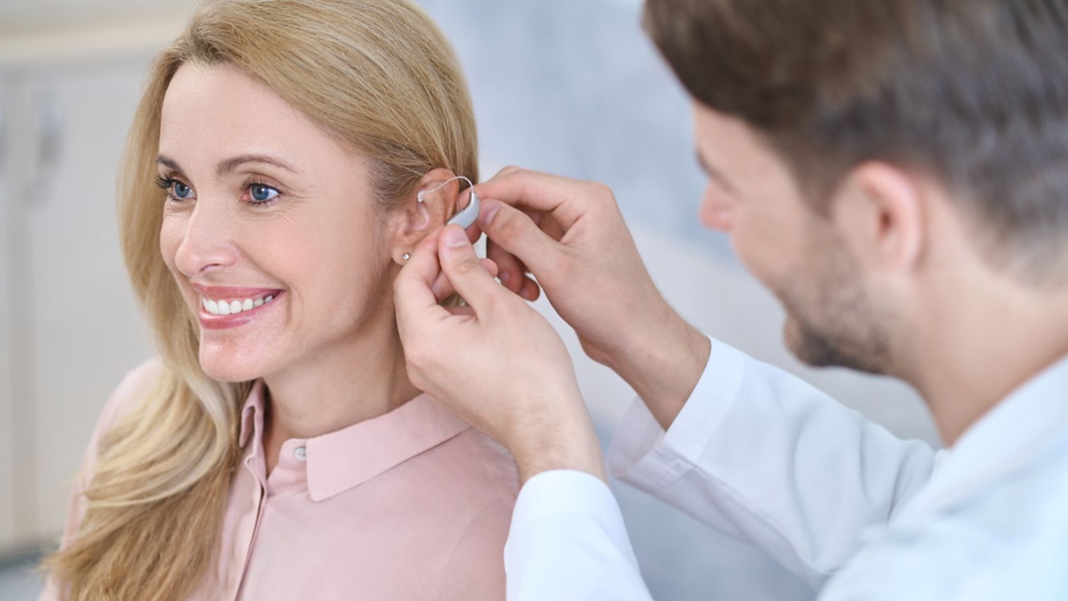 Patient getting fitted for a hearing aid