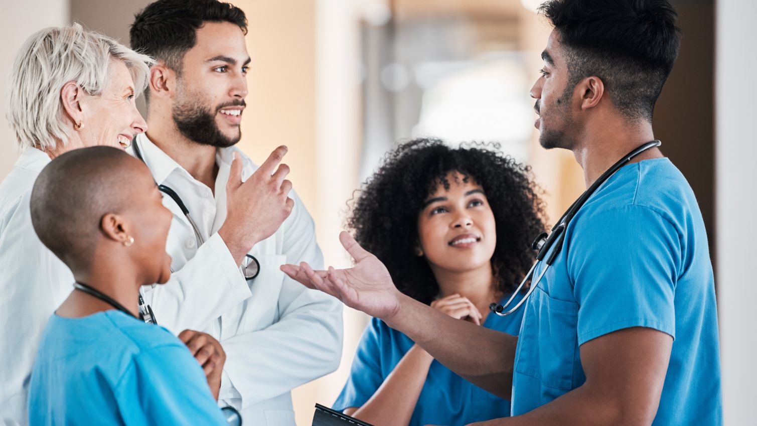 A group of young doctors having a conversation in an office