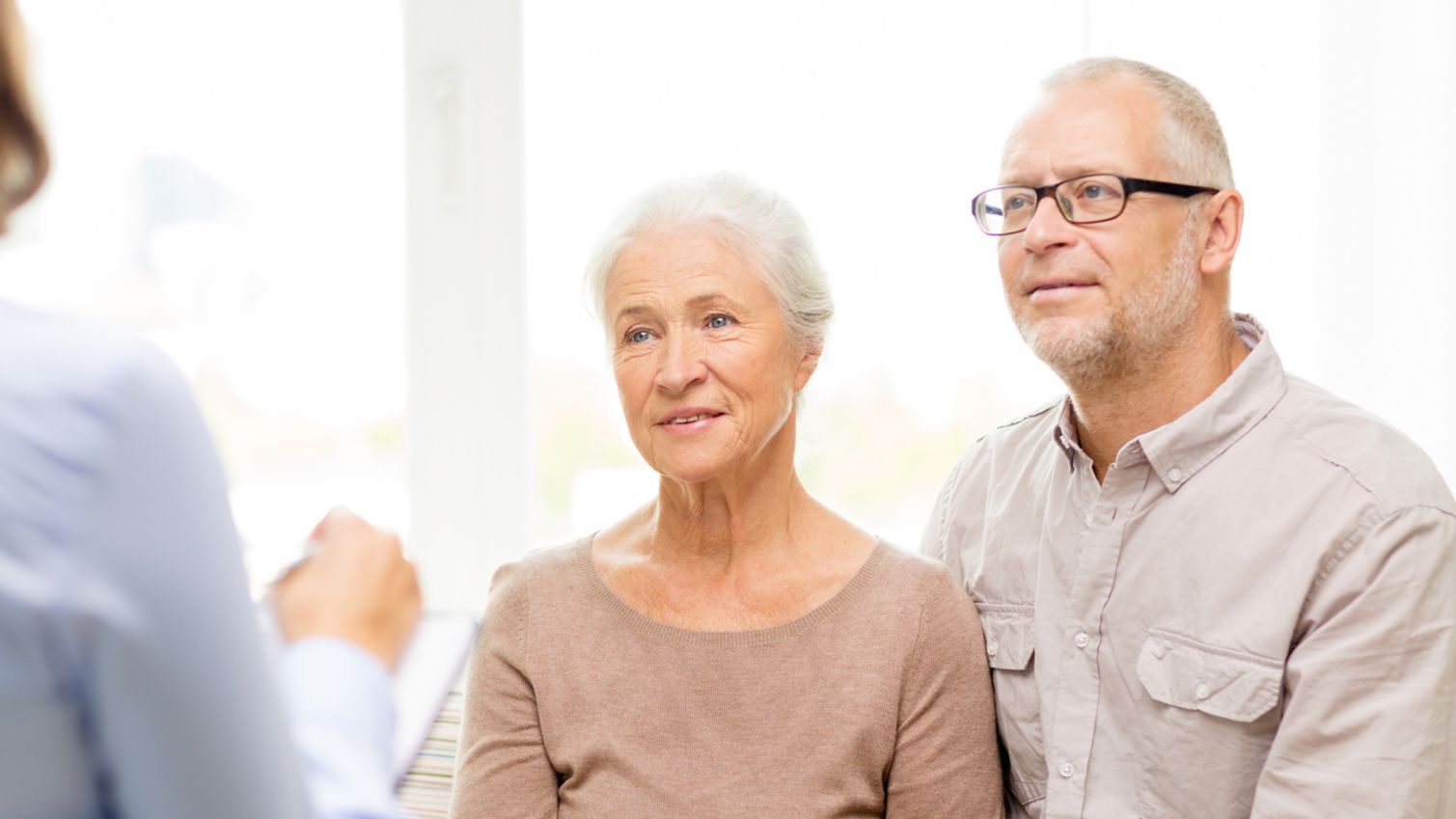 people looking intently at health care professional