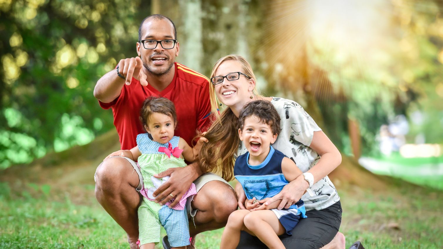 Family smiling for a photograph