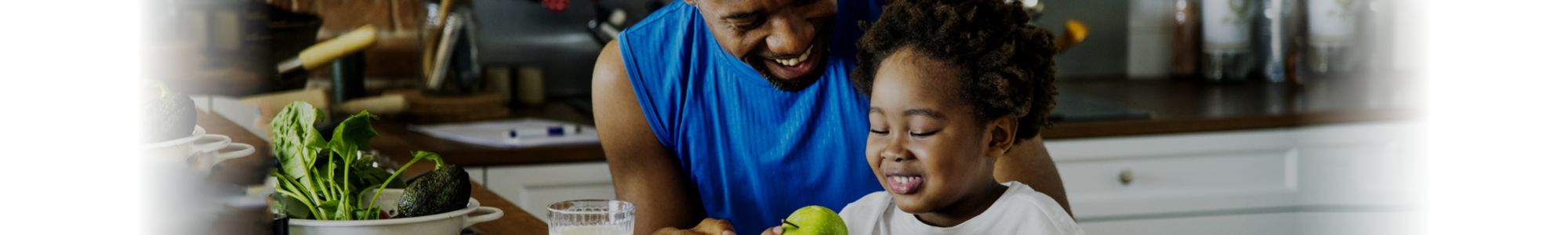 Father and child eating healthy meal