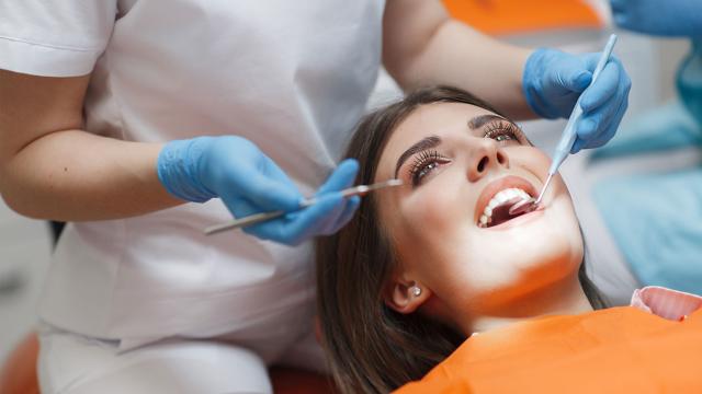 A patient has their teeth cleaned.