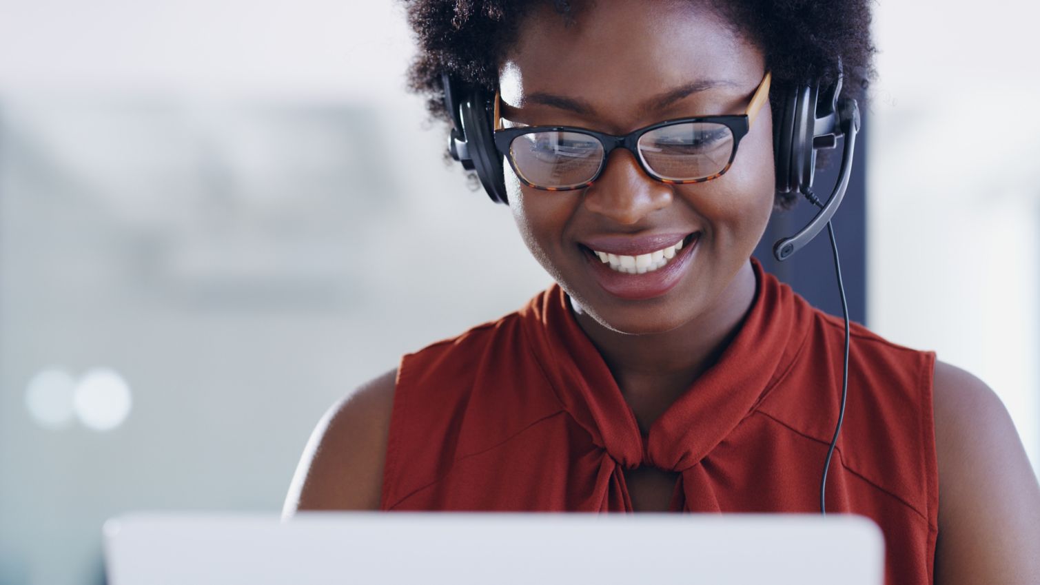 Customer Care representative helps enrollee on the phone