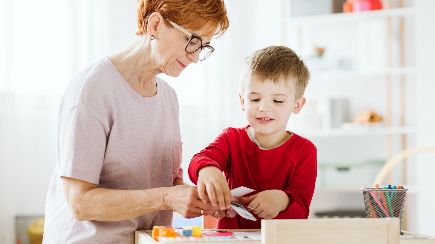 Caregiver works with child who has special needs