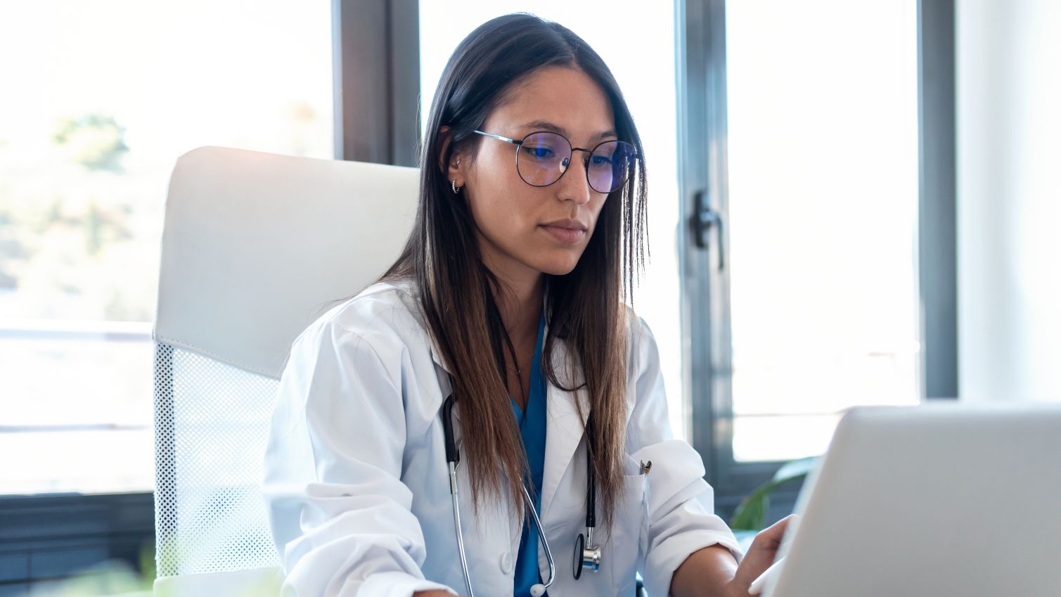 A female doctor working on her computer