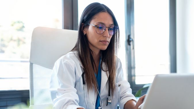 A female doctor working on her computer