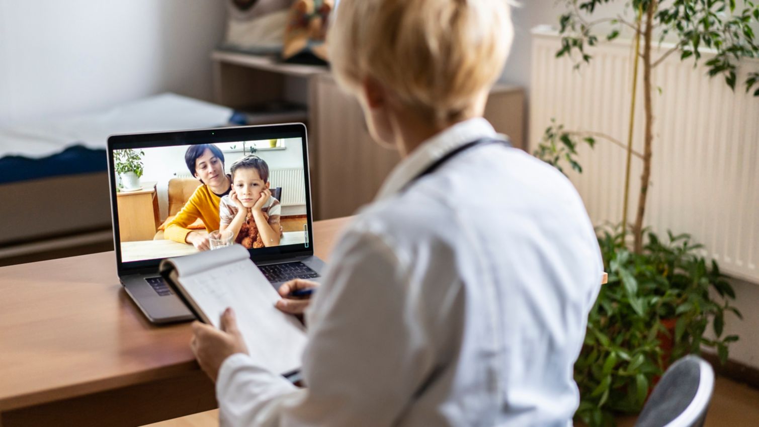 Medicaid provider meets with a mom and her son online