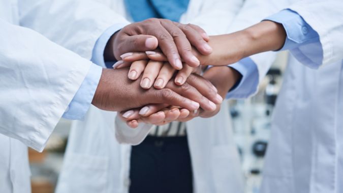 A team of doctors celebrating together