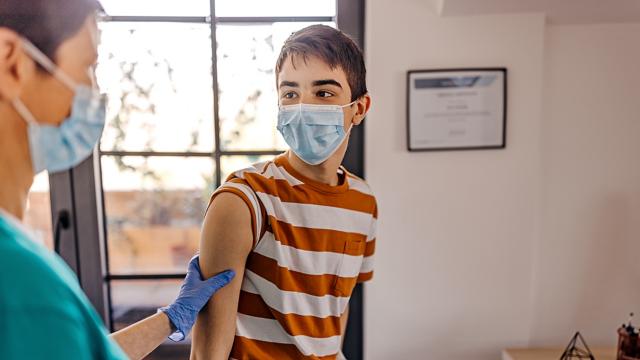 Medicaid provider gives flu vaccine to young male patient