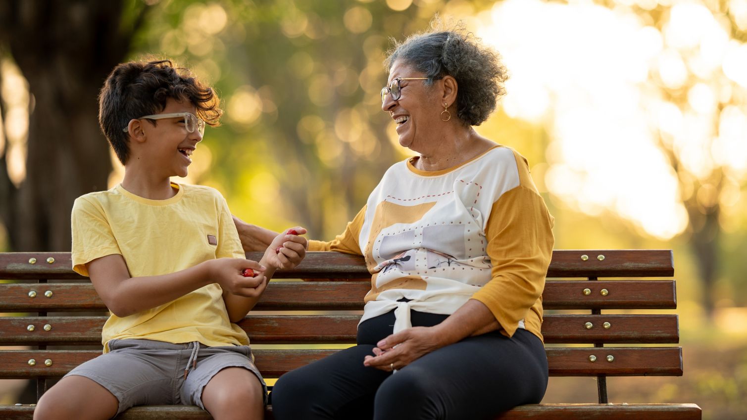 Grandmother talks to grandson outside