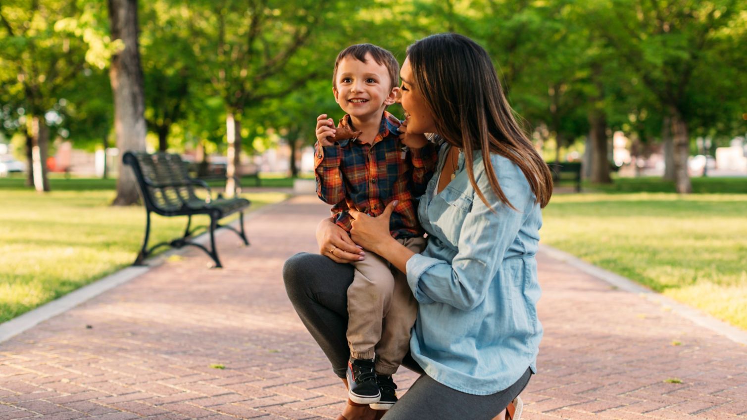 Mother plays with son outside